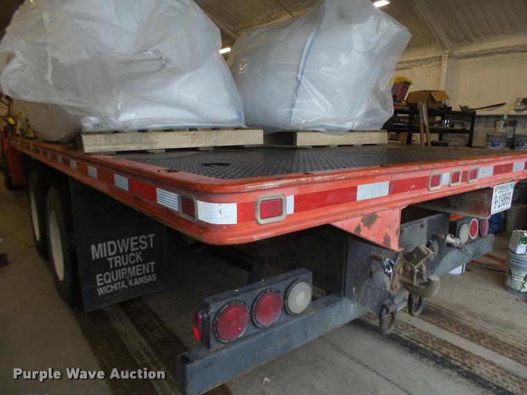 image for item L4184 1999 Sterling L8513 flatbed truck with crane