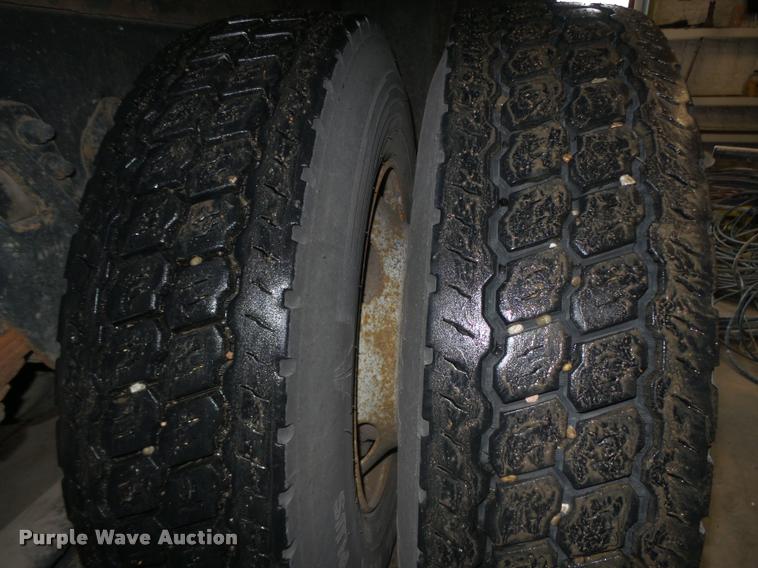 image for item L4184 1999 Sterling L8513 flatbed truck with crane