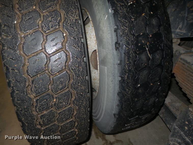 image for item L4184 1999 Sterling L8513 flatbed truck with crane