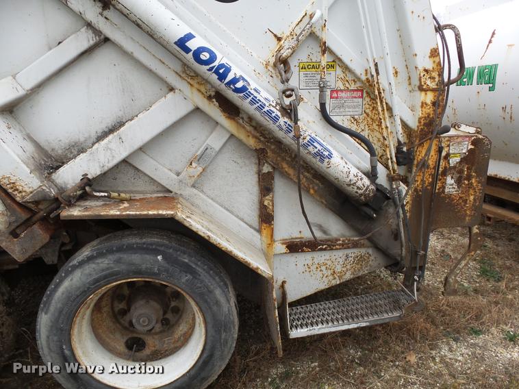 image for item K1010 2002 GMC C8500 refuse truck