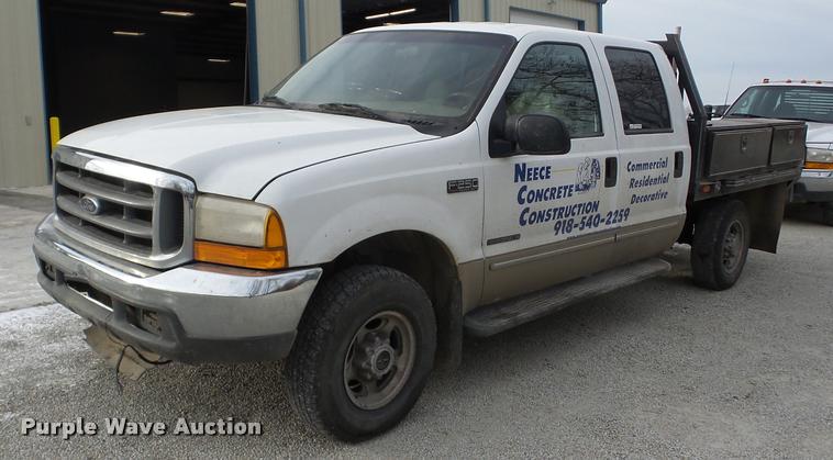 image for item AG9279 2000 Ford F250 Super Duty Crew Cab flatbed pickup truck