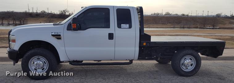 image for item L1726 2010 Ford F250 Super Duty SuperCab flatbed pickup truck