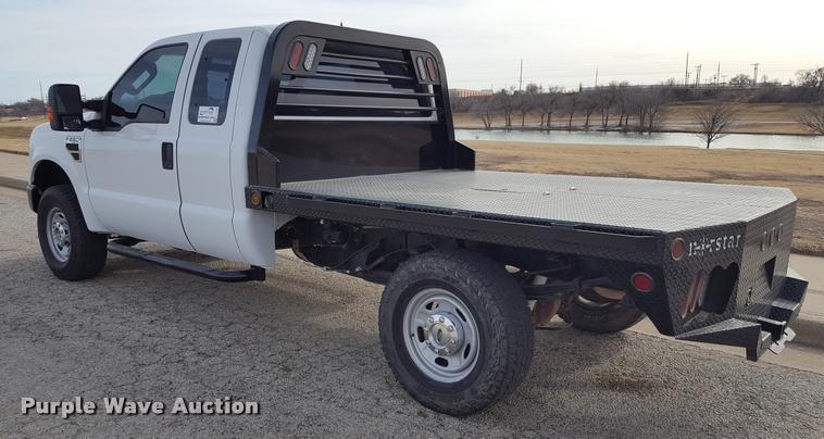image for item L1726 2010 Ford F250 Super Duty SuperCab flatbed pickup truck