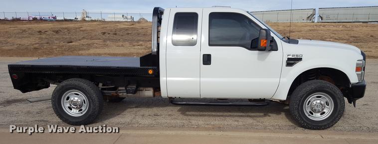 image for item L1726 2010 Ford F250 Super Duty SuperCab flatbed pickup truck