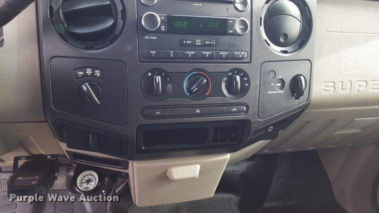 image for item L1726 2010 Ford F250 Super Duty SuperCab flatbed pickup truck