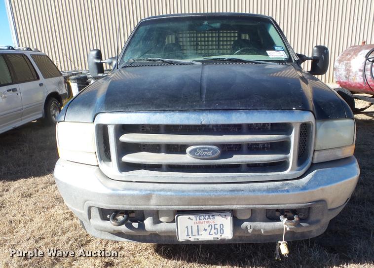 image for item DA7578 2002 Ford F250 Super Duty Crew Cab flatbed pickup truck