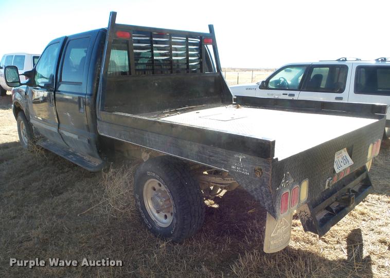 image for item DA7578 2002 Ford F250 Super Duty Crew Cab flatbed pickup truck