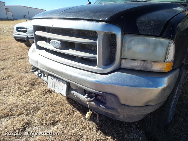 image for item DA7578 2002 Ford F250 Super Duty Crew Cab flatbed pickup truck