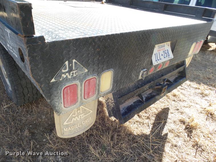 image for item DA7578 2002 Ford F250 Super Duty Crew Cab flatbed pickup truck