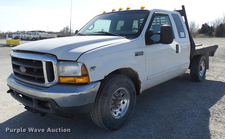 image for item DB2339 2001 Ford F250 XLT SuperCab flatbed pickup truck