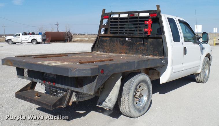 image for item DB2339 2001 Ford F250 XLT SuperCab flatbed pickup truck