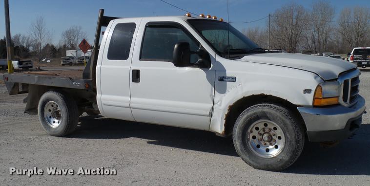 image for item DB2339 2001 Ford F250 XLT SuperCab flatbed pickup truck