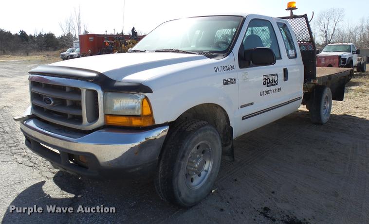 image for item DB2353 1999 Ford F250 Super Duty SuperCab flatbed pickup truck