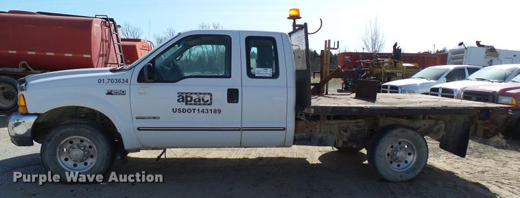 image for item DB2353 1999 Ford F250 Super Duty SuperCab flatbed pickup truck