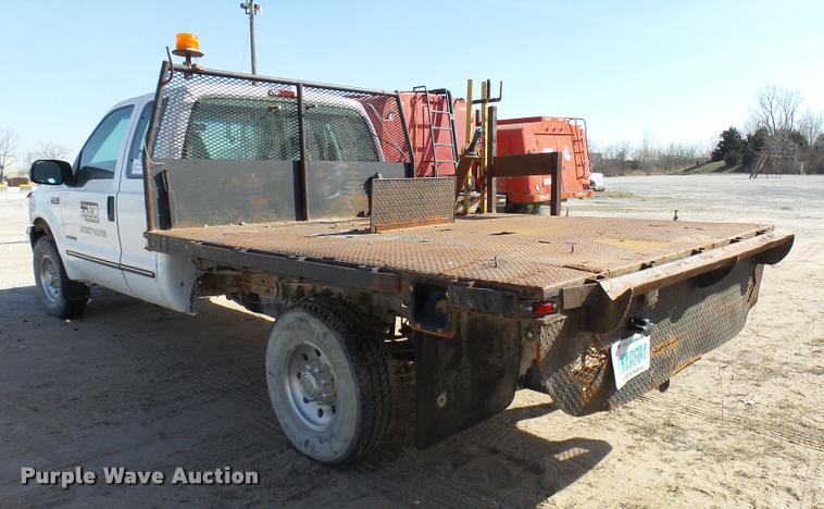 image for item DB2353 1999 Ford F250 Super Duty SuperCab flatbed pickup truck