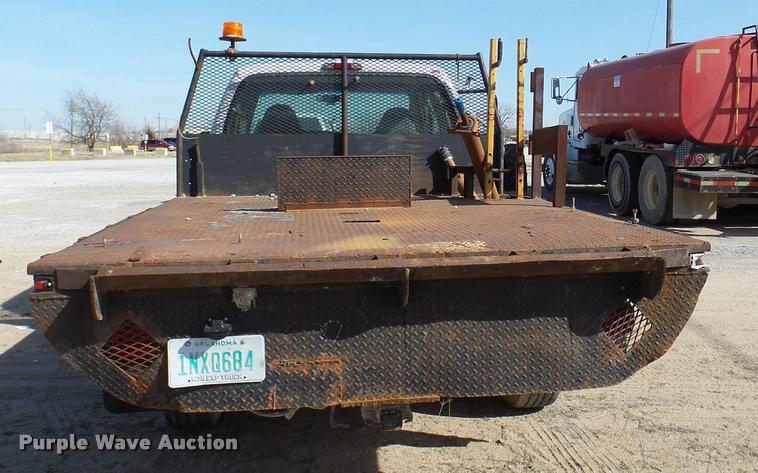 image for item DB2353 1999 Ford F250 Super Duty SuperCab flatbed pickup truck