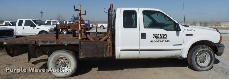 image for item DB2353 1999 Ford F250 Super Duty SuperCab flatbed pickup truck