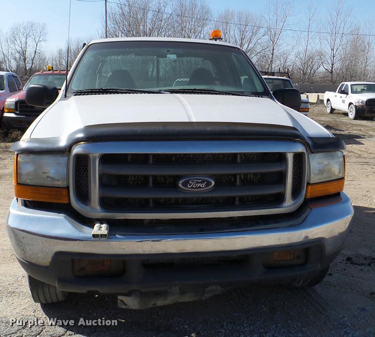 image for item DB2353 1999 Ford F250 Super Duty SuperCab flatbed pickup truck