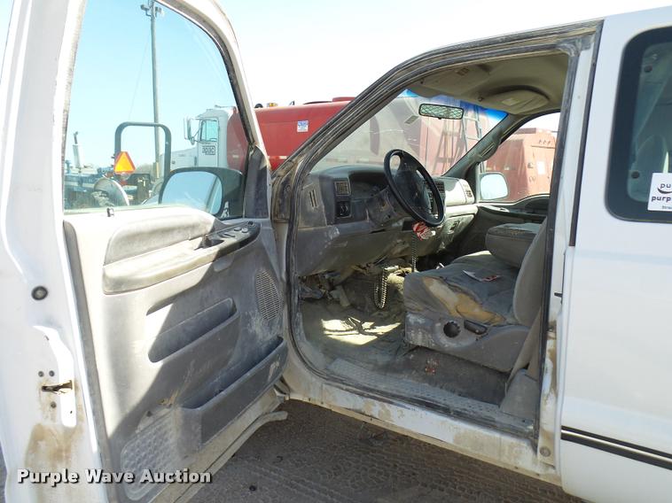 image for item DB2353 1999 Ford F250 Super Duty SuperCab flatbed pickup truck