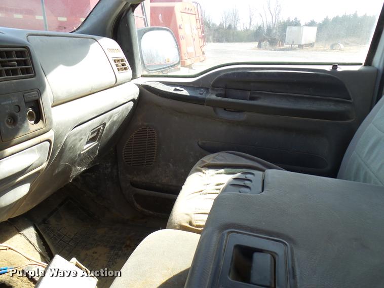 image for item DB2353 1999 Ford F250 Super Duty SuperCab flatbed pickup truck