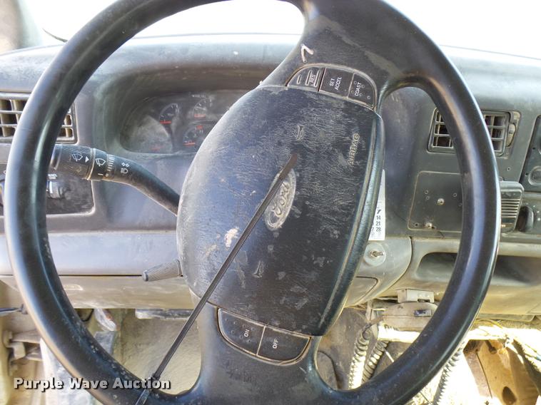 image for item DB2353 1999 Ford F250 Super Duty SuperCab flatbed pickup truck