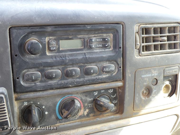 image for item DB2353 1999 Ford F250 Super Duty SuperCab flatbed pickup truck