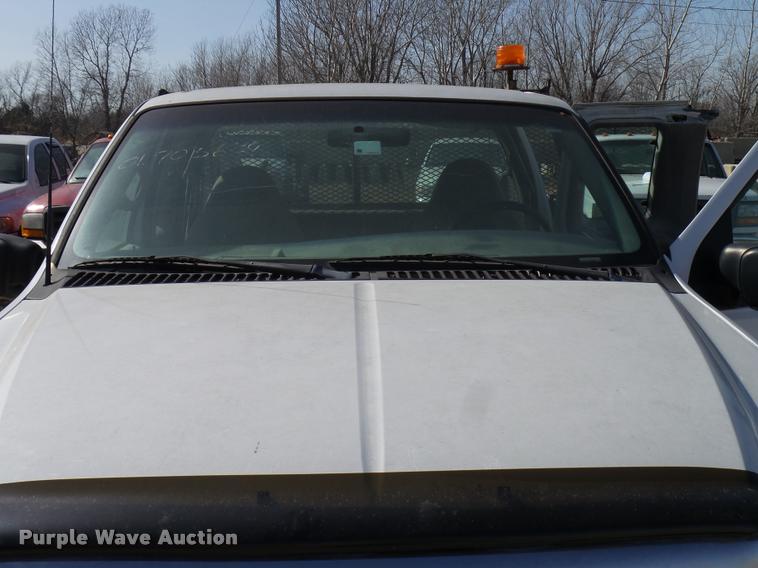 image for item DB2353 1999 Ford F250 Super Duty SuperCab flatbed pickup truck