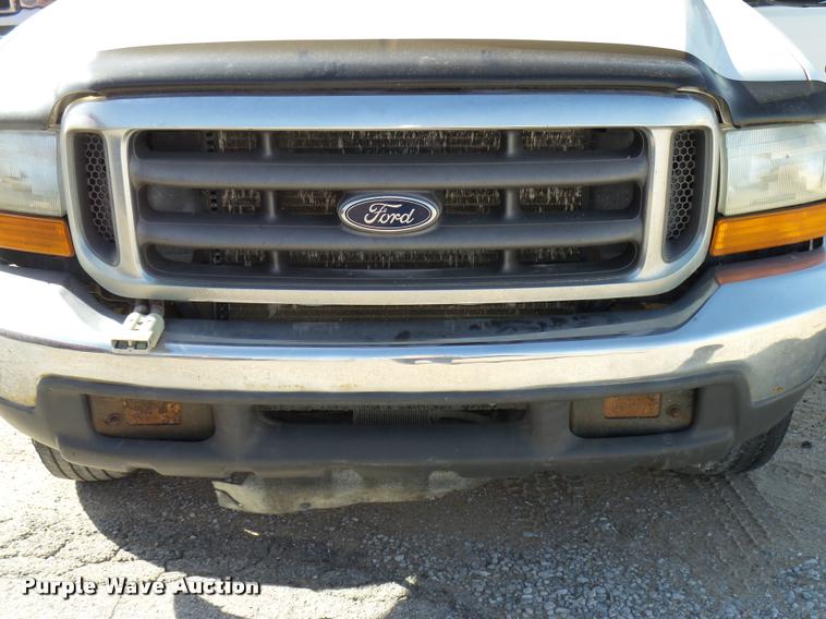 image for item DB2353 1999 Ford F250 Super Duty SuperCab flatbed pickup truck
