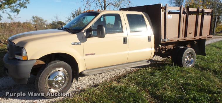 image for item DA3776 2004 Ford F450 Super Duty Crew Cab flatbed dump truck