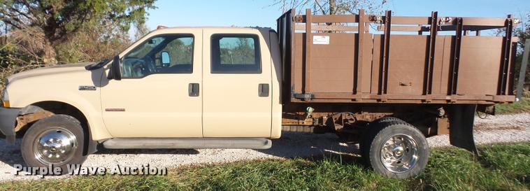 image for item DA3776 2004 Ford F450 Super Duty Crew Cab flatbed dump truck