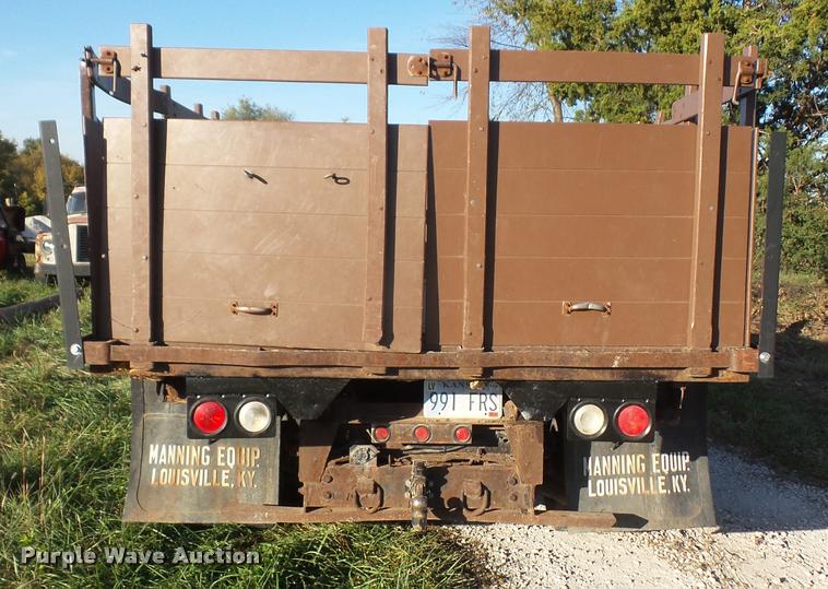 image for item DA3776 2004 Ford F450 Super Duty Crew Cab flatbed dump truck