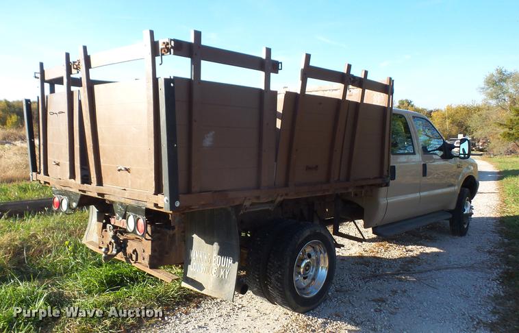 image for item DA3776 2004 Ford F450 Super Duty Crew Cab flatbed dump truck