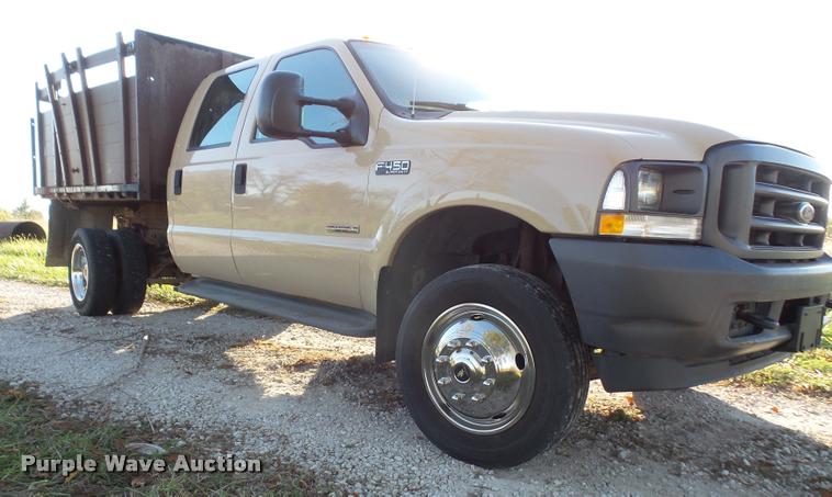 image for item DA3776 2004 Ford F450 Super Duty Crew Cab flatbed dump truck