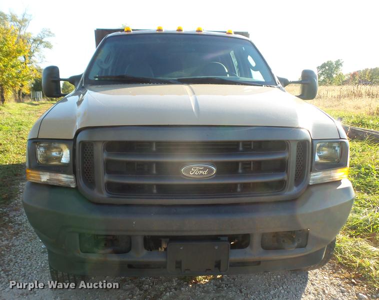 image for item DA3776 2004 Ford F450 Super Duty Crew Cab flatbed dump truck