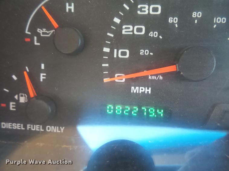 image for item DA3776 2004 Ford F450 Super Duty Crew Cab flatbed dump truck