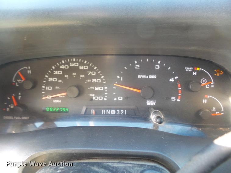 image for item DA3776 2004 Ford F450 Super Duty Crew Cab flatbed dump truck