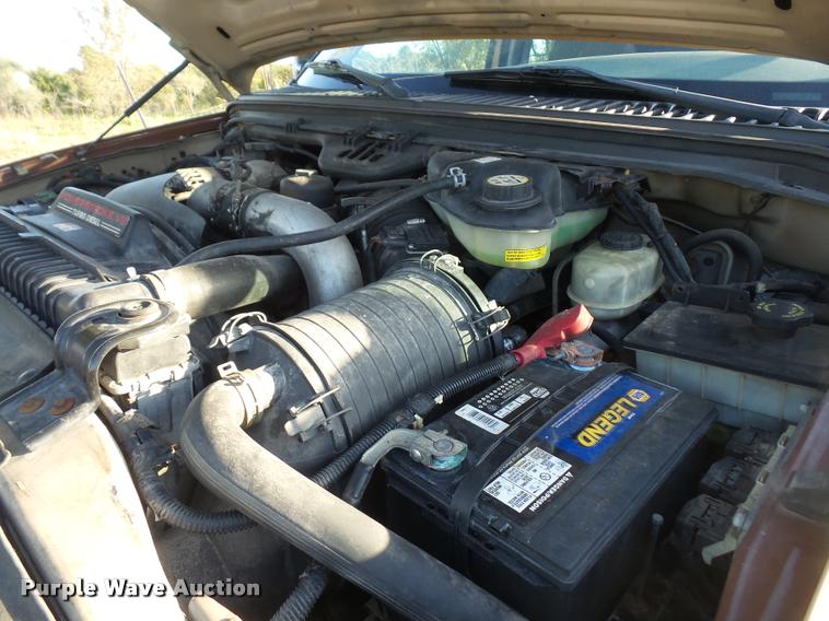 image for item DA3776 2004 Ford F450 Super Duty Crew Cab flatbed dump truck