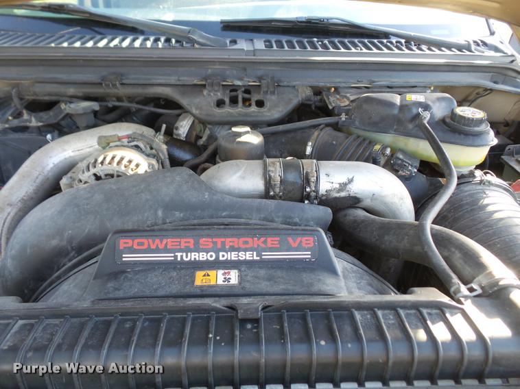 image for item DA3776 2004 Ford F450 Super Duty Crew Cab flatbed dump truck