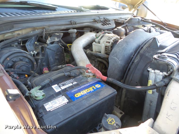 image for item DA3776 2004 Ford F450 Super Duty Crew Cab flatbed dump truck