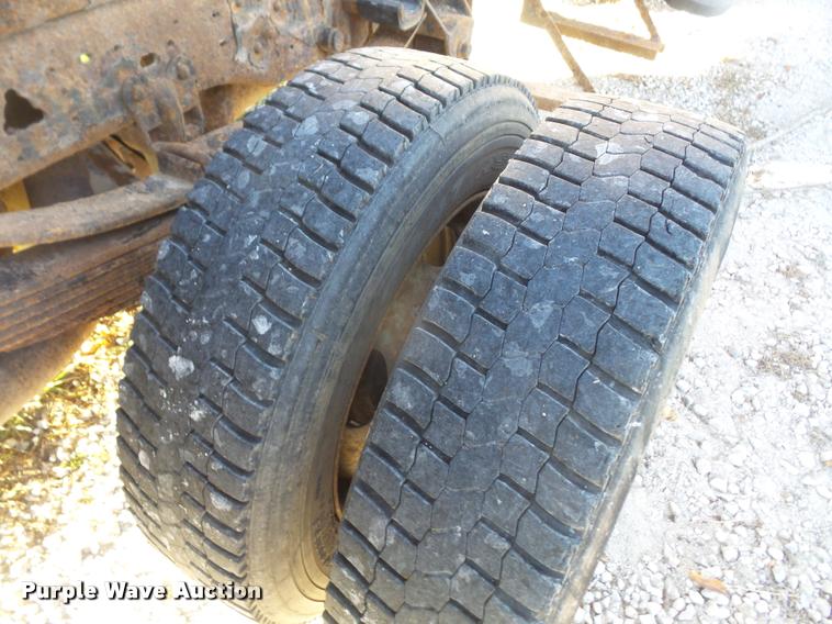 image for item DA3776 2004 Ford F450 Super Duty Crew Cab flatbed dump truck