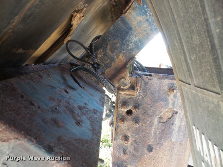 image for item DA3776 2004 Ford F450 Super Duty Crew Cab flatbed dump truck