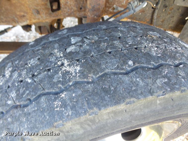 image for item DA3776 2004 Ford F450 Super Duty Crew Cab flatbed dump truck