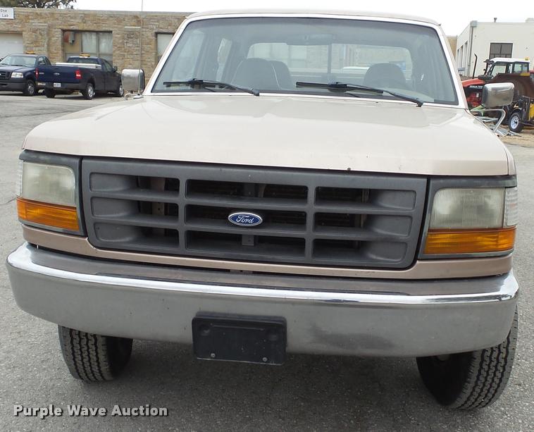 image for item DB0704 1997 Ford F250 Super Duty XL Crew Cab utility bed pickup truck