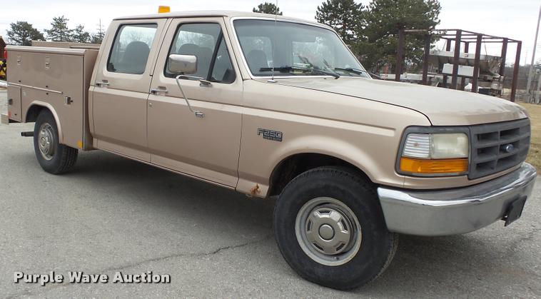 image for item DB0704 1997 Ford F250 Super Duty XL Crew Cab utility bed pickup truck