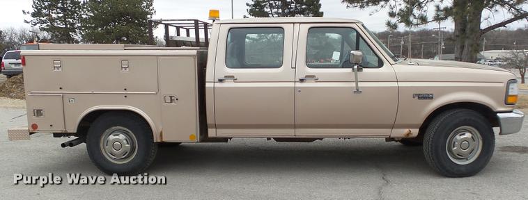 image for item DB0704 1997 Ford F250 Super Duty XL Crew Cab utility bed pickup truck