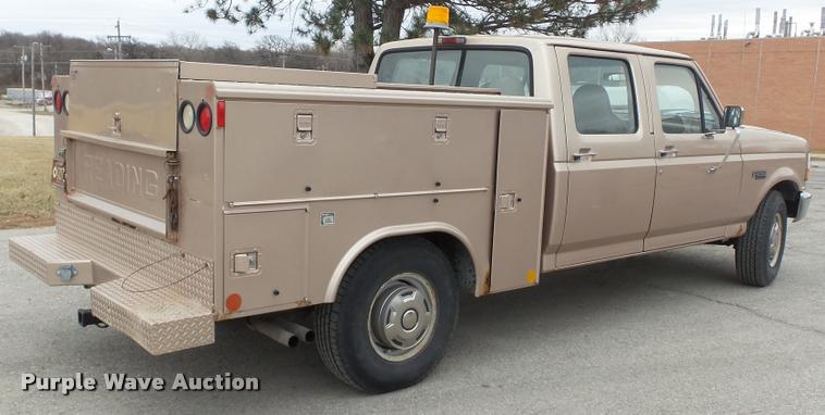 image for item DB0704 1997 Ford F250 Super Duty XL Crew Cab utility bed pickup truck
