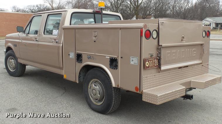 image for item DB0704 1997 Ford F250 Super Duty XL Crew Cab utility bed pickup truck