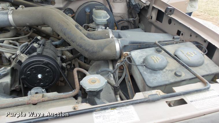 image for item DB0704 1997 Ford F250 Super Duty XL Crew Cab utility bed pickup truck