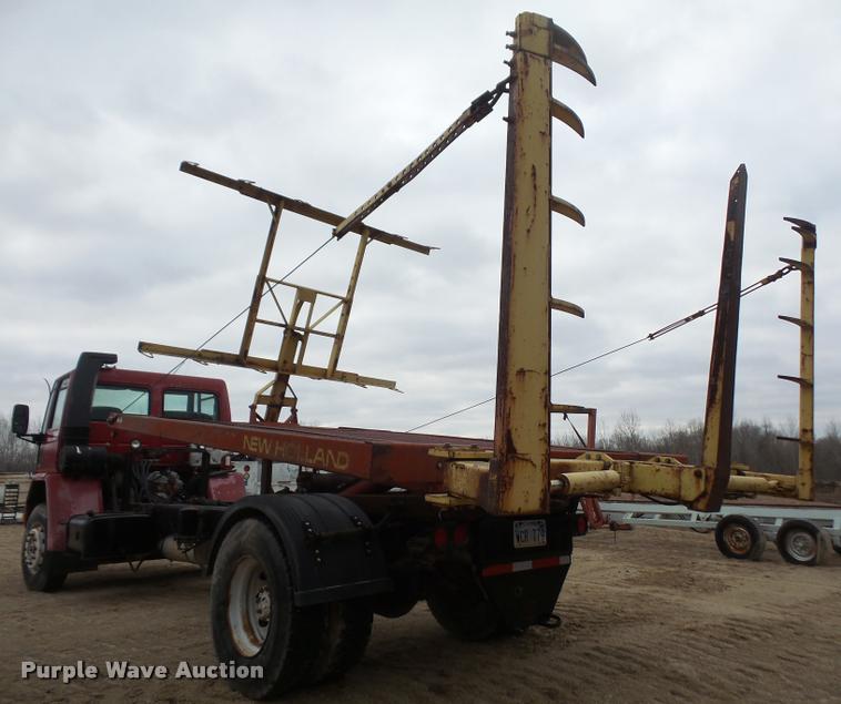 image for item DB2911 1990 Ford Cargo 8000 truck with New Holland 1060 bale stacker retriever