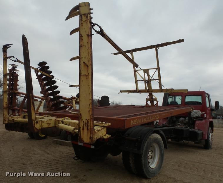 image for item DB2911 1990 Ford Cargo 8000 truck with New Holland 1060 bale stacker retriever